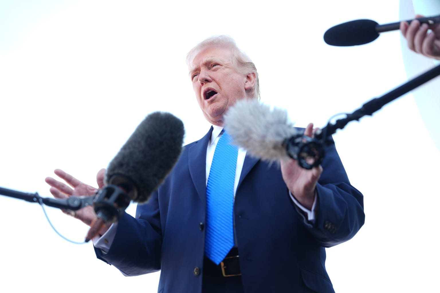 President Trump speaks to reporters at Palm Beach International Airport on March 23, 2026 about Iran talks