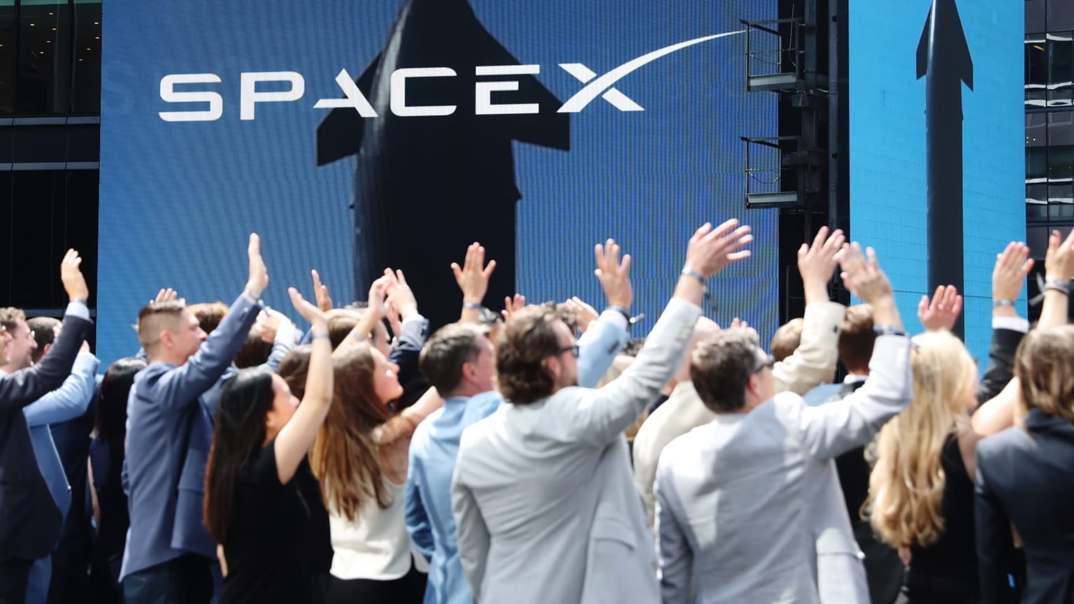 A SpaceX rocket and the company logo on a trading floor display, illustrating the June 12 2026 ThriveInMarkets evening review as SpaceX made its record Nasdaq debut under the ticker SPCX, opening at 150 dollars against a 135 dollar IPO price and closing up about 19 percent near 160.95 dollars to value the company above 2 trillion dollars in the largest initial public offering in history, lifting broad sentiment as the S&P 500 rose 0.5 percent to a fresh high near 7,431.46, the Nasdaq Composite added 0.31 percent to 25,888.84, the Dow Jones Industrial Average climbed 353.51 points or 0.7 percent to 51,202.26 and the small-cap Russell 2000 gained 0.79 percent to 2,943.99, while WTI crude fell more than 4 percent below 84 dollars to an eight-week low on US-Iran peace optimism, spot gold held near 4,210 dollars, Bitcoin steadied around 63,473 dollars and Ethereum lagged near 1,666 dollars