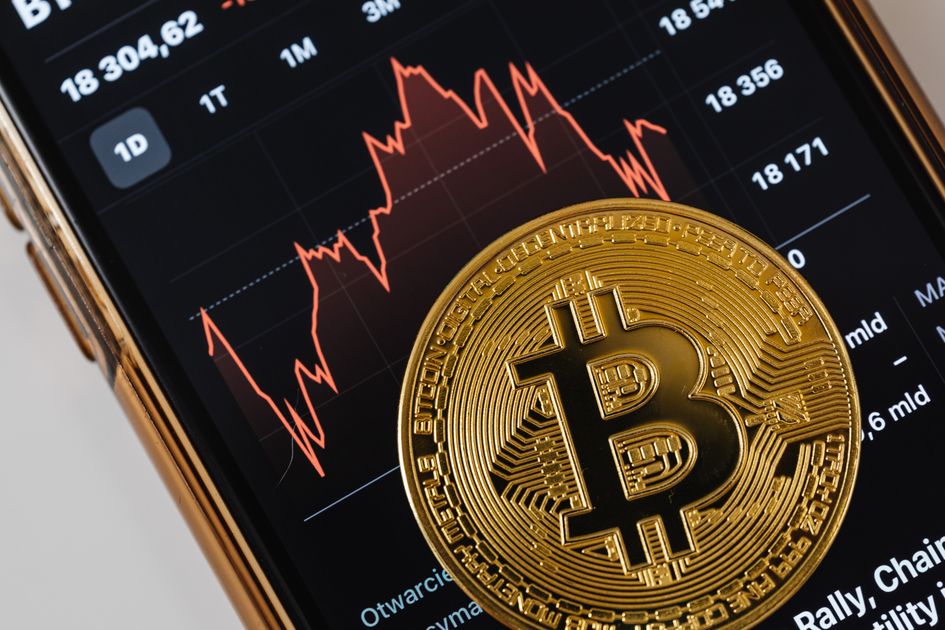A golden physical Bitcoin coin propped beside a smartphone displaying a candlestick price chart, illustrating the ThriveInMarkets evening review crypto check for Tuesday July 7 2026 as Bitcoin held near 63,691 dollars and Ethereum steadied near 1,784 dollars, diverging from a US stock session that slipped from record highs as the AI chip trade reversed and SpaceX fell more than 6 percent on its Nasdaq-100 inclusion day, while US spot Bitcoin ETFs logged another day of net inflows extending a reversal from June's roughly 4.5 billion dollars of outflows.