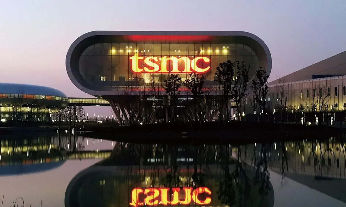 The TSMC headquarters building glows at dusk with its illuminated logo reflected in a still pool of water, used in the ThriveInMarkets morning analysis for Thursday July 16 2026 as a rebound in semiconductor shares led by a 27 percent overnight jump in SK Hynix American depositary receipts and a strong outlook from ASML revived the artificial-intelligence chip trade, lifting S&P 500 futures toward 7,615 after Wednesday's record-adjacent close of 7,572.40, ahead of Taiwan Semiconductor Manufacturing Company and Netflix quarterly earnings, June US retail sales and weekly jobless claims, with Ether up about 2 percent to $1,907, Bitcoin steady near $64,500, gold around $4,028 and WTI crude holding near $80