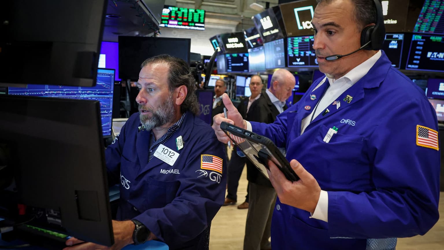 Traders on the floor of the New York Stock Exchange, used in the ThriveInMarkets morning analysis for July 20 2026 as US equities reopen after Friday's semiconductor-led selloff and into a Fed-blackout week headlined by Alphabet and Tesla earnings