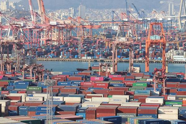 Container stacks and orange gantry cranes at a South Korean port, used as the ThriveInMarkets morning analysis inline image for Thursday October 1 2026, when South Korea's September exports jumped 83.5 percent to a record 120.9 billion dollars as semiconductor shipments more than tripled to 60.3 billion dollars