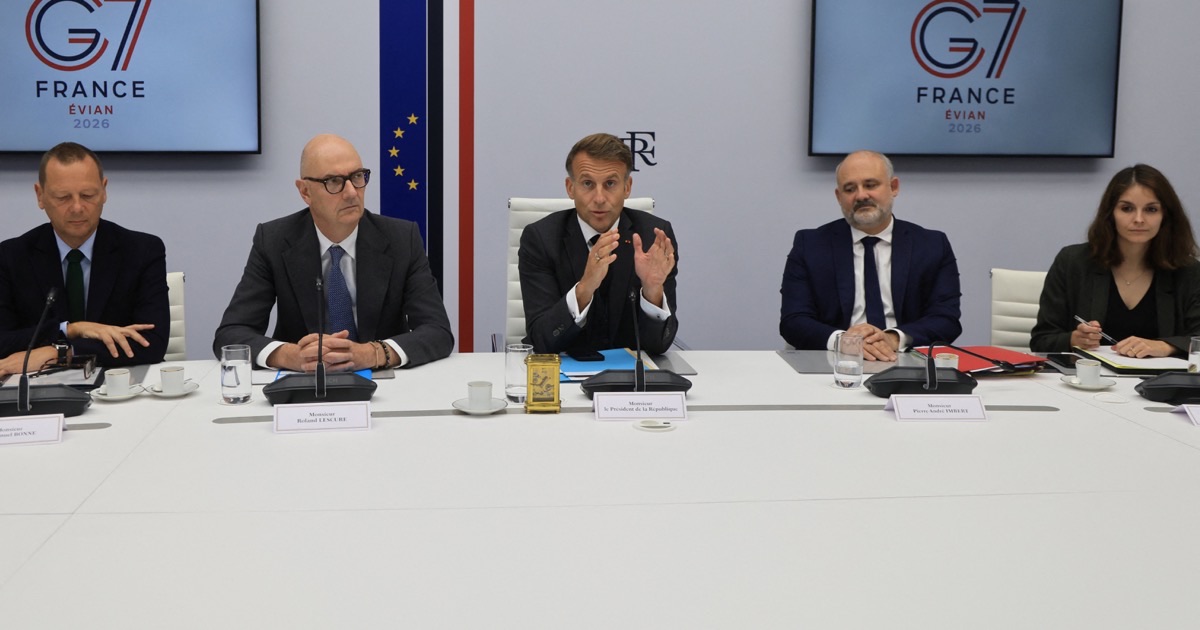 French President Emmanuel Macron speaks at a G7 France Evian 2026 table with ministers, used as the ThriveInMarkets weekend recap hero for September 28 to October 4 2026, when G7 leaders agreed to release 100 million barrels of diesel and crude through the IEA, West Texas Intermediate settled 91.11 dollars Friday, September payrolls printed 29,000, and the S&P 500 closed Friday at 7,722.72 down 0.3 percent on the week